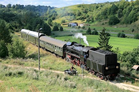 Beautiful hilly landscape with an old retro steam train Photographie de stock - Aubaine LD & Abonnement, Code: 400-05674062