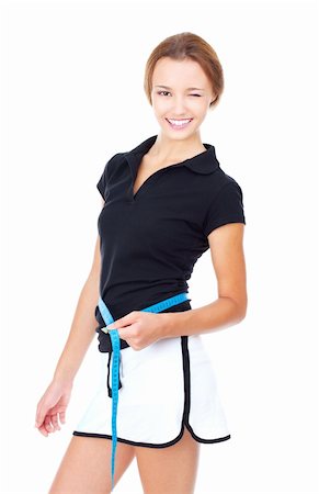 Young woman measuring the shape. The concept of a healthy lifestyle. Isolated on white Stock Photo - Budget Royalty-Free & Subscription, Code: 400-05675127