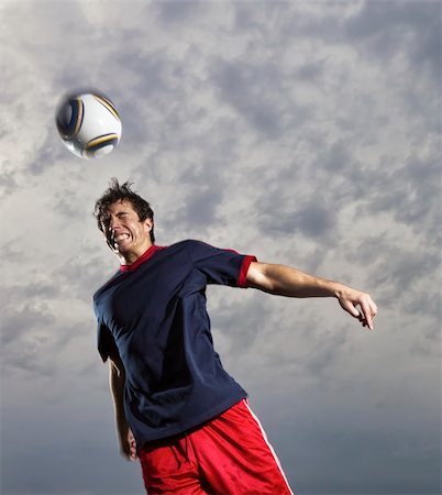 Image of a soccer player in action Stock Photo - Budget Royalty-Free & Subscription, Code: 400-05675372