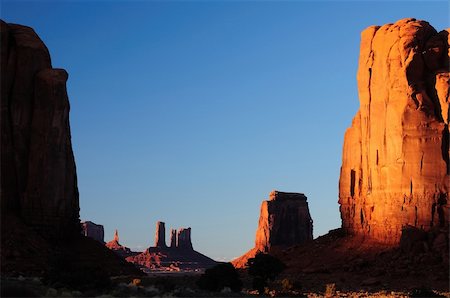 simsearch:862-08091453,k - A beautiful composition of the monument valley Navajo tribal park through the North Window glowing at sunset Stock Photo - Budget Royalty-Free & Subscription, Code: 400-05675599