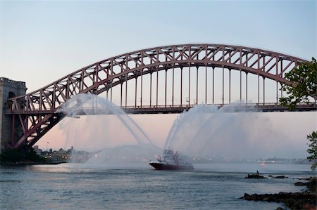 fire department new york city - FDNY Fire Boat sprays water in front of NYC's Hell Gate Bridge. Stock Photo - Budget Royalty-Free & Subscription, Code: 400-05675988