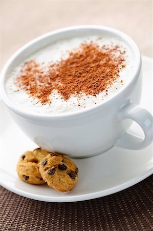 Cappuccino or latte coffee in cup with frothed milk and cookies Stock Photo - Budget Royalty-Free & Subscription, Code: 400-05677043