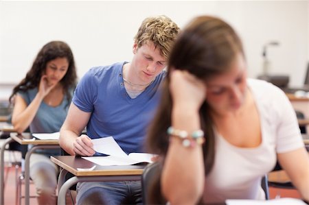 simsearch:400-05677768,k - Good looking students doing an assignment in a classroom Stock Photo - Budget Royalty-Free & Subscription, Code: 400-05677745