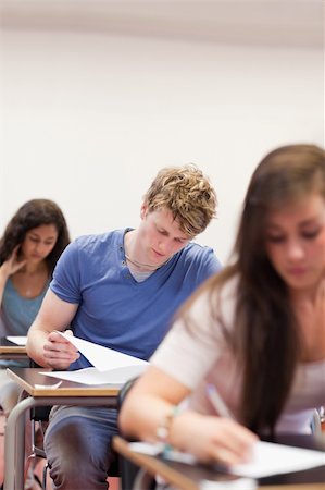 simsearch:400-05677768,k - Portrait of young students doing an assignment in a classroom Stock Photo - Budget Royalty-Free & Subscription, Code: 400-05677754