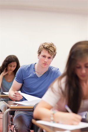 simsearch:400-05677768,k - Portrait of young students having a test in a classroom Stock Photo - Budget Royalty-Free & Subscription, Code: 400-05677755