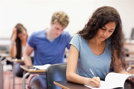 simsearch:400-05677768,k - Young students working on an assignment in a classroom Stock Photo - Budget Royalty-Free & Subscription, Code: 400-05677757