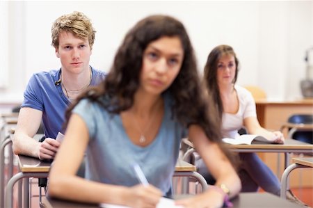 simsearch:400-05677768,k - Focused students taking notes in a classroom Stock Photo - Budget Royalty-Free & Subscription, Code: 400-05677769
