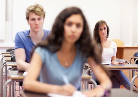 simsearch:400-05677768,k - Serious students taking notes in a classroom Stock Photo - Budget Royalty-Free & Subscription, Code: 400-05677770