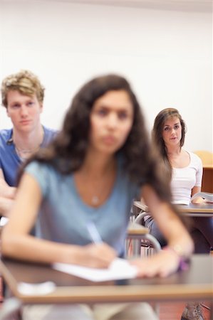 simsearch:400-05677768,k - Portrait of serious students taking notes in a classroom Stock Photo - Budget Royalty-Free & Subscription, Code: 400-05677771