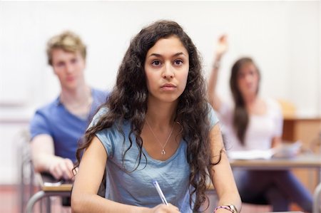 simsearch:400-05677768,k - Student listening to her teacher in a classroom Stock Photo - Budget Royalty-Free & Subscription, Code: 400-05677773