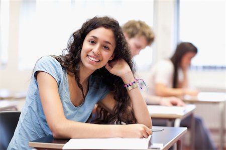 simsearch:400-05677768,k - Smiling young student posing in a classroom Stock Photo - Budget Royalty-Free & Subscription, Code: 400-05677797