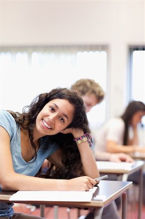 simsearch:400-05677768,k - Portrait of a smiling young student posing in a classroom Stock Photo - Budget Royalty-Free & Subscription, Code: 400-05677798
