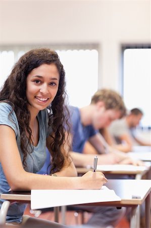 simsearch:400-05677768,k - Portrait of a serious student writing in a classroom Stock Photo - Budget Royalty-Free & Subscription, Code: 400-05677803