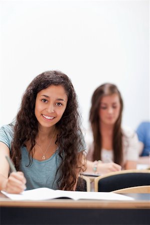 simsearch:400-05677768,k - Portrait smiling young students sitting in an amphitheater Stock Photo - Budget Royalty-Free & Subscription, Code: 400-05677817