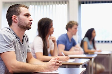 simsearch:400-05677768,k - Handsome young man listening in a classroom Stock Photo - Budget Royalty-Free & Subscription, Code: 400-05677811