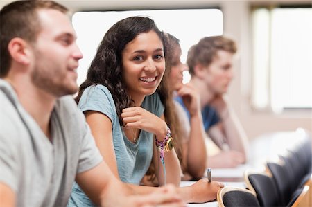 simsearch:400-05677768,k - Smiling students listening a lecturer in an amphitheater Stock Photo - Budget Royalty-Free & Subscription, Code: 400-05677835