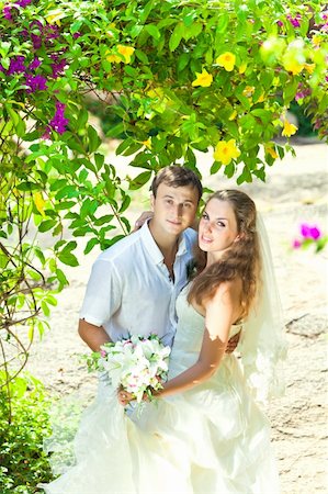 simsearch:400-05328142,k - Bride and groom in a tropical garden Stock Photo - Budget Royalty-Free & Subscription, Code: 400-05677896