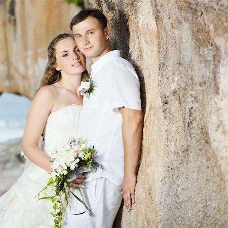 simsearch:400-05328142,k - Bride and groom on the beach. Tropical wedding Stock Photo - Budget Royalty-Free & Subscription, Code: 400-05677892