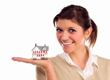 Pretty Smiling Ethnic Female Holding Small House in Hand Isolated on a White Background. Stock Photo - Budget Royalty-Free & Subscription, Code: 400-05678081