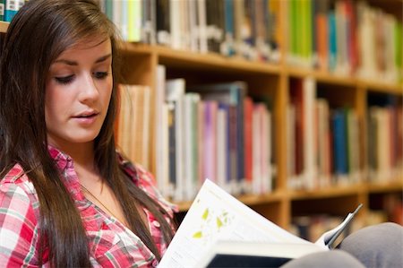 simsearch:400-05669803,k - Female student reading in a library Stock Photo - Budget Royalty-Free & Subscription, Code: 400-05678120