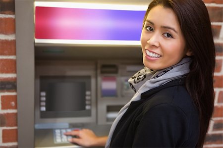 simsearch:400-05670021,k - Woman withdrawing cash at an ATM Stock Photo - Budget Royalty-Free & Subscription, Code: 400-05670016