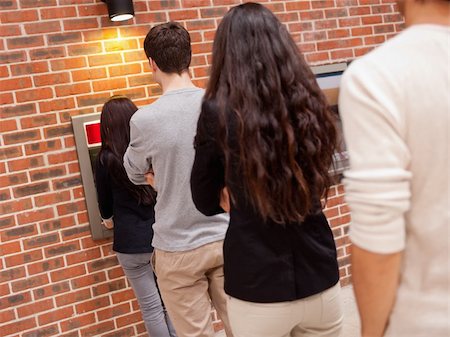 People queuing to withdraw cash at an ATM Stock Photo - Budget Royalty-Free & Subscription, Code: 400-05670019