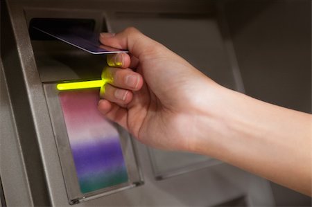 simsearch:400-05670020,k - Close up of a hand inserting a credit card in an ATM Stock Photo - Budget Royalty-Free & Subscription, Code: 400-05670012