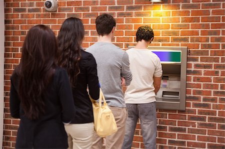 simsearch:400-05670020,k - Young people queuing to withdraw cash in an ATM Stock Photo - Budget Royalty-Free & Subscription, Code: 400-05670021