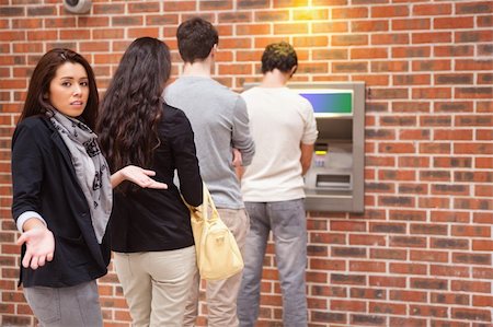 simsearch:400-05670021,k - Impatient woman queuing at an ATM Stock Photo - Budget Royalty-Free & Subscription, Code: 400-05670023