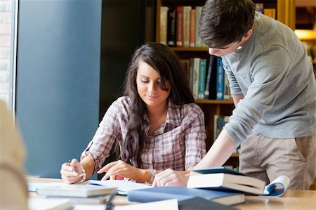 simsearch:400-05669803,k - Young students working on a essay in a library Stock Photo - Budget Royalty-Free & Subscription, Code: 400-05670277
