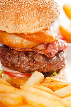 simsearch:400-06090558,k - classic american hamburger sandwich with onion rings and french fries, MORE DELICIOUS FOOD ON PORTFOLIO Stock Photo - Budget Royalty-Free & Subscription, Code: 400-05670310