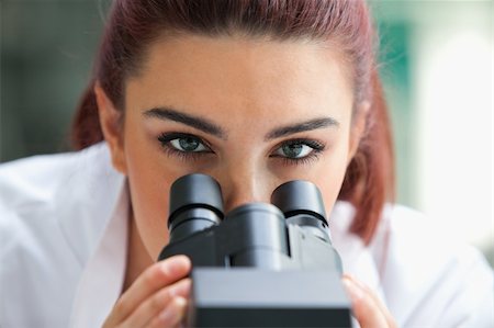 simsearch:400-05669968,k - Close up of a scientist posing with a microscope in a laboratory Stock Photo - Budget Royalty-Free & Subscription, Code: 400-05670360