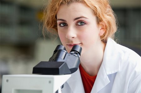 simsearch:400-05669968,k - Close up of a young student posing with a microscope in a laboratory Stock Photo - Budget Royalty-Free & Subscription, Code: 400-05670435