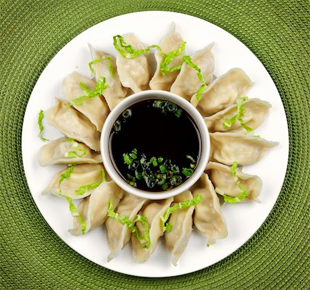 dim sum restaurant photography - Plate of steamed dumplings with soy sauce from above Stock Photo - Budget Royalty-Free & Subscription, Code: 400-05671205