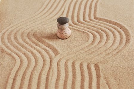 simsearch:400-05373814,k - stone in circles on a sand background Stock Photo - Budget Royalty-Free & Subscription, Code: 400-05673662