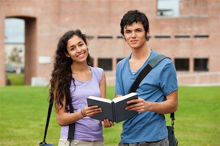 simsearch:400-05357982,k - Couple holding a book outside a building Stock Photo - Budget Royalty-Free & Subscription, Code: 400-05684101