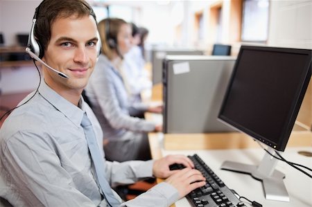 Assistant using a computer in a call center Stock Photo - Budget Royalty-Free & Subscription, Code: 400-05684273