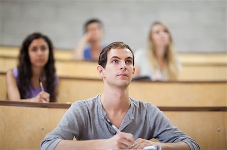 Students listening during a lecture in an amphitheater Stock Photo - Budget Royalty-Free & Subscription, Code: 400-05684319