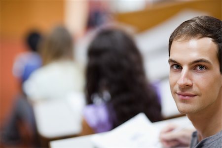 Student being distracted in an amphitheater Stock Photo - Budget Royalty-Free & Subscription, Code: 400-05684378