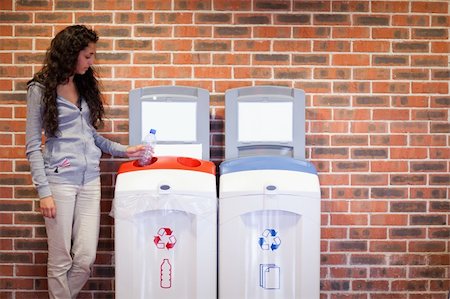 simsearch:400-07301131,k - Portrait of a young woman recycling a plastic bottle Stock Photo - Budget Royalty-Free & Subscription, Code: 400-05684449