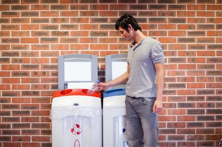 simsearch:400-07301131,k - Young man recycling a plastic bottle Stock Photo - Budget Royalty-Free & Subscription, Code: 400-05684451
