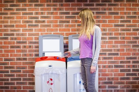 simsearch:400-07050071,k - Cute woman recycling a plastic bottle Stock Photo - Budget Royalty-Free & Subscription, Code: 400-05684453
