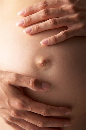 pregnancy nude - Detail Of Pregnant Woman Holding Stomach Stock Photo - Budget Royalty-Free & Subscription, Code: 400-05686486