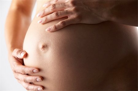 pregnancy nude - Detail Of Pregnant Woman Holding Stomach Stock Photo - Budget Royalty-Free & Subscription, Code: 400-05686488