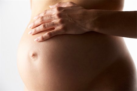 pregnancy nude - Detail Of Pregnant Woman Holding Stomach Stock Photo - Budget Royalty-Free & Subscription, Code: 400-05686489