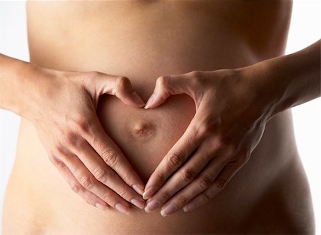 pregnancy nude - Detail Of Pregnant Woman Forming Heart Shape With Hands Stock Photo - Budget Royalty-Free & Subscription, Code: 400-05686500