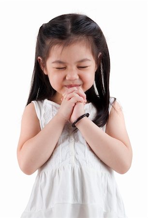 Little girl wishing on white background Stock Photo - Budget Royalty-Free & Subscription, Code: 400-05687780