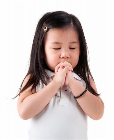 Little girl praying on white background Stock Photo - Budget Royalty-Free & Subscription, Code: 400-05687781