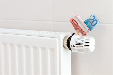 energy money - Heating thermostat with euros, expensive heating concept Foto de stock - Super Valor sin royalties y Suscripción, Código: 400-05680189