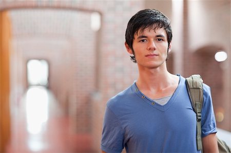 Handsome student posing in a corridor Stock Photo - Budget Royalty-Free & Subscription, Code: 400-05681038